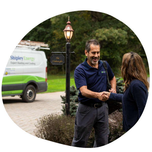 Shipley Energy HVAC Technician shaking hands with a homeowner